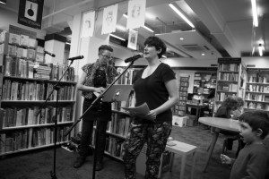 Hinemoana Baker Rachel O’Neill reading a short welcome from Hue & Cry Press publisher Chloe Lane who is currently based in Florida. (Image by Matt Bialostocki)